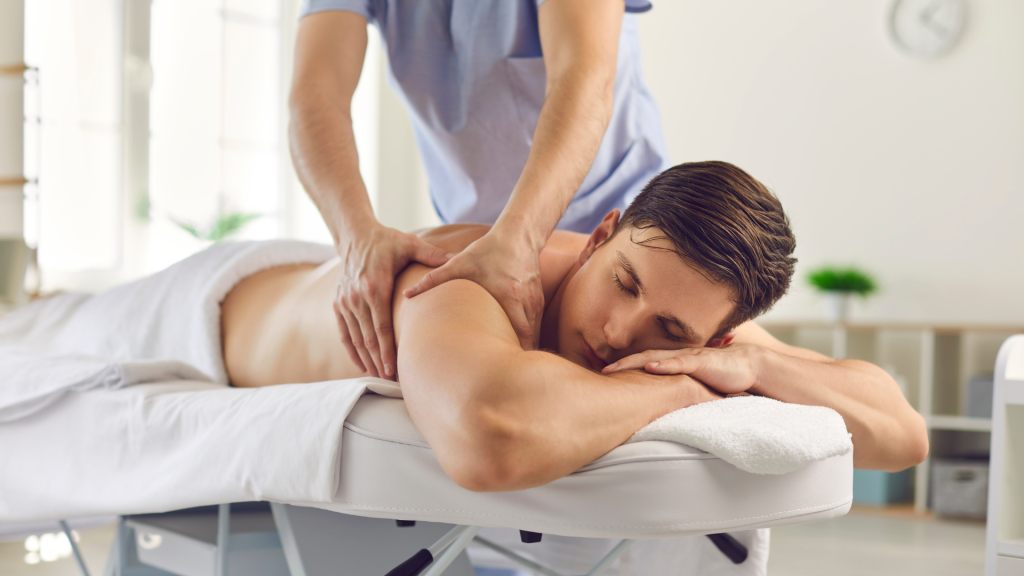 A man being treated through Bowen Therapy by a professional